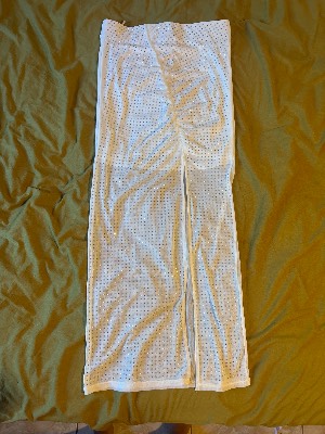 Long white bedazzled mesh skirt with asymmetric slit