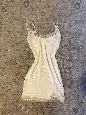 Bodycon white mini dress with lace and adjustable straps